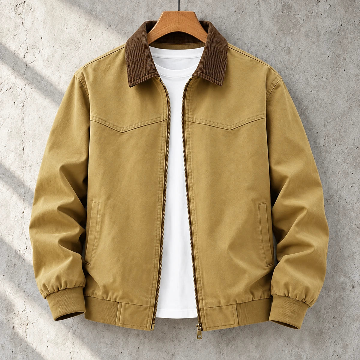 Cotton Jacket | Bennett Brown front garment hanging on simple wooden hanger on concrete wall