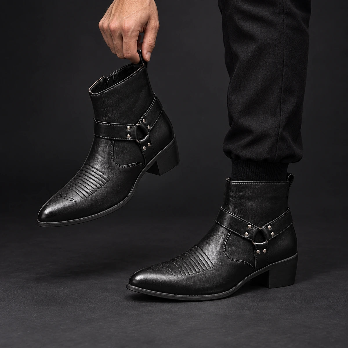 Leather Boots | Lucius Black model holding matching footwear