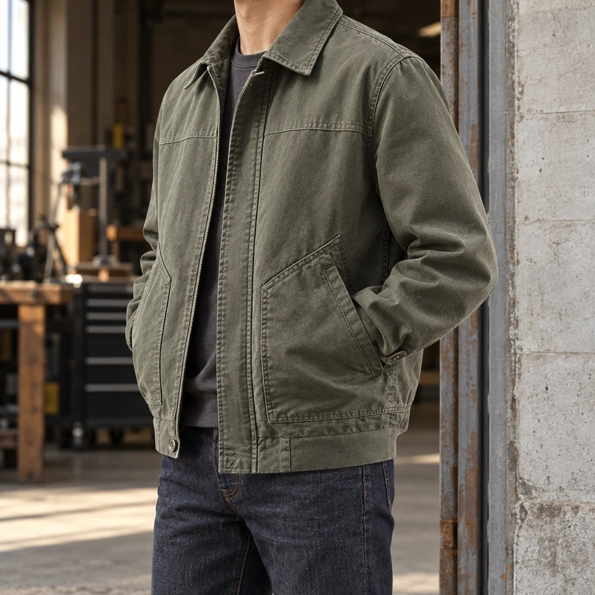 Cotton Jacket | Hugo Green neck-down wearer standing side-on at concrete workshop entrance