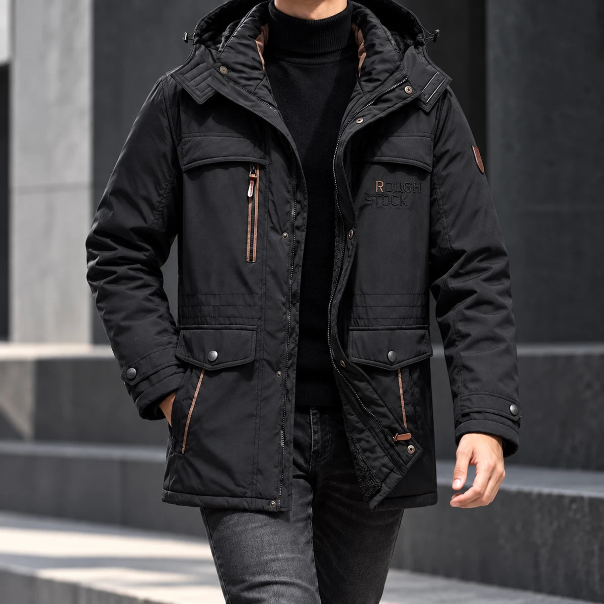 Fleece Parka | Colin Black neck-down wearer walking beside dark concrete architecture