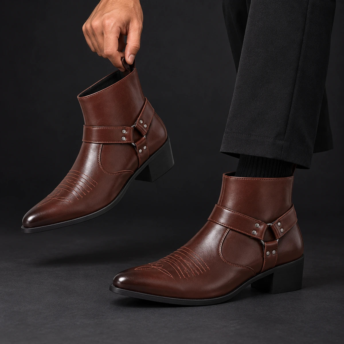 Leather Boots | Lucius Brown model holding matching footwear